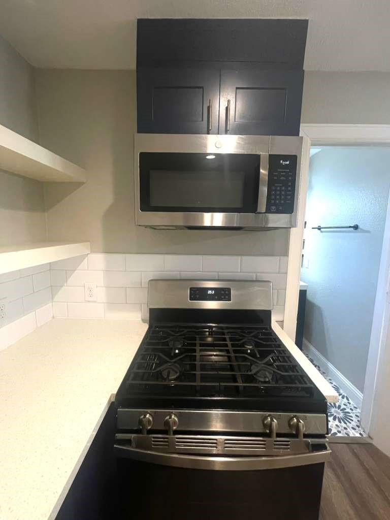 3807 Edison Street Houston, TX 77009 - Photo 10 of 11 a stove top oven sitting inside of a kitchen