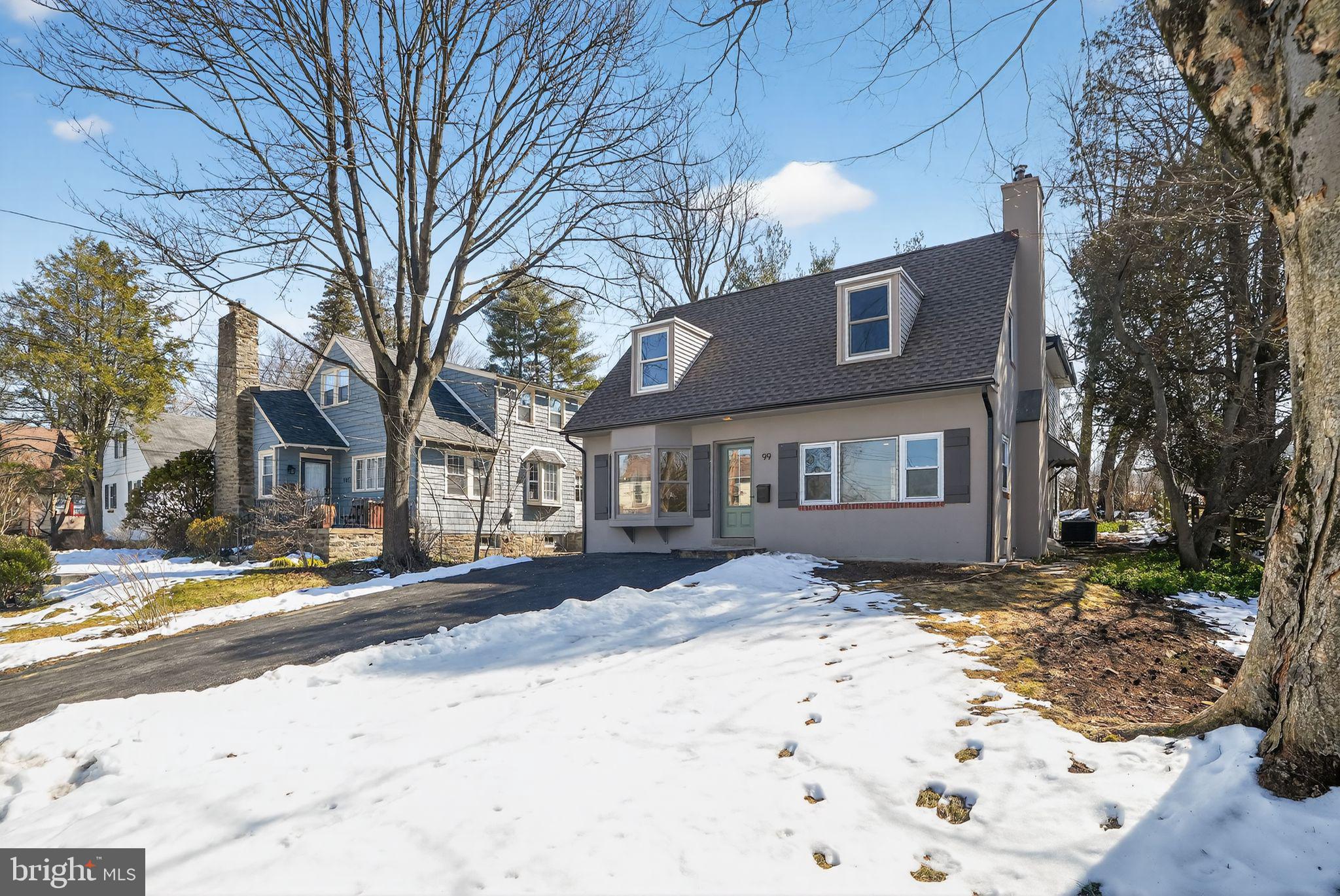 99 Rorer Street Glenside, PA 19038 - Photo 1 of 36 a front view of a house with a yard covered in snow