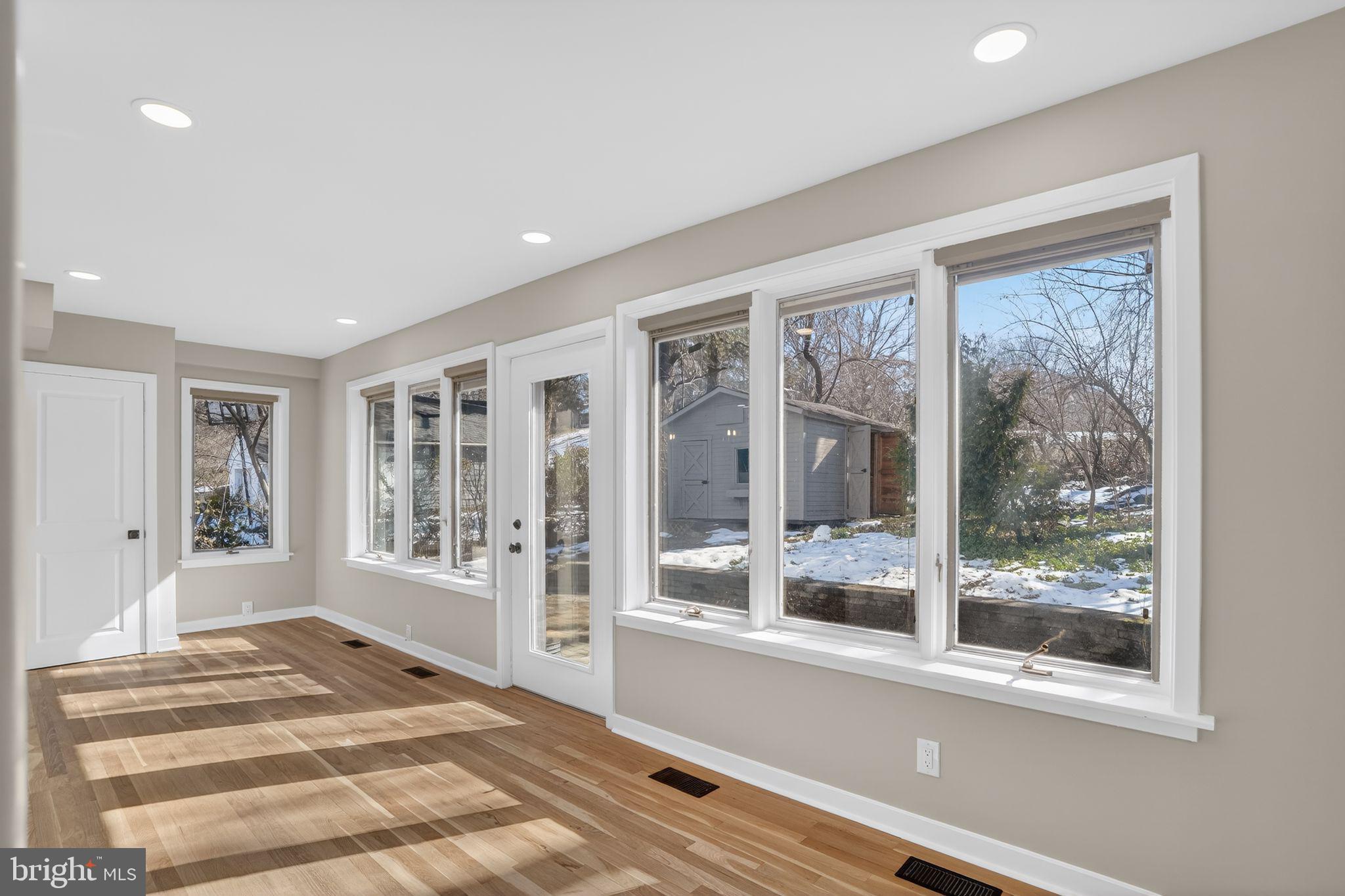 99 Rorer Street Glenside, PA 19038 - Photo 17 of 36 a view of an entryway with wooden floor and windows