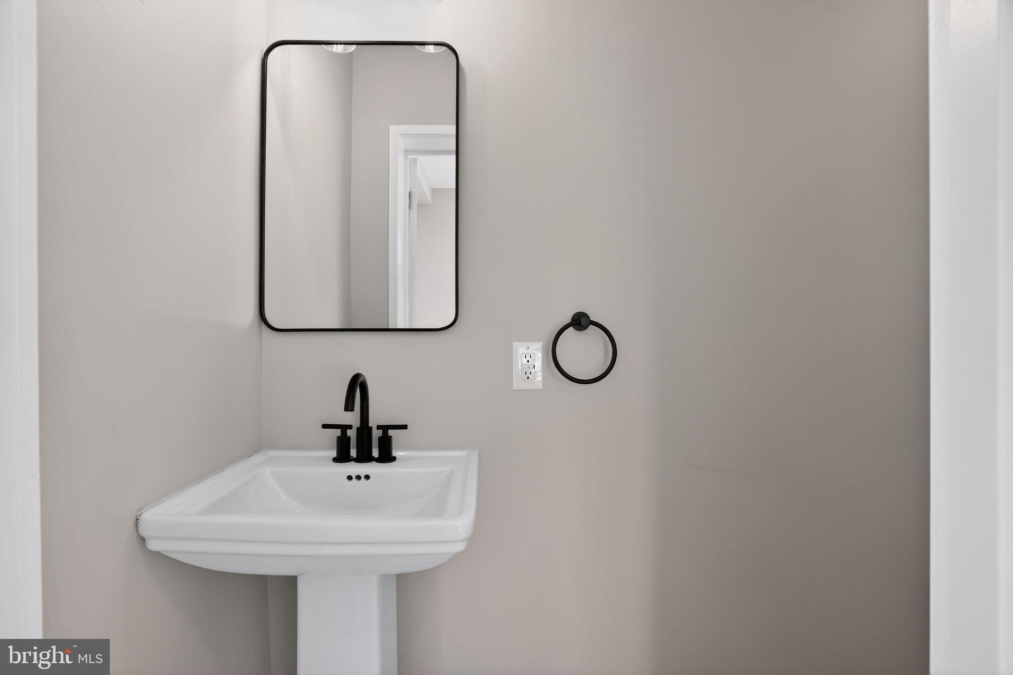 99 Rorer Street Glenside, PA 19038 - Photo 18 of 36 a bathroom with a sink and a mirror