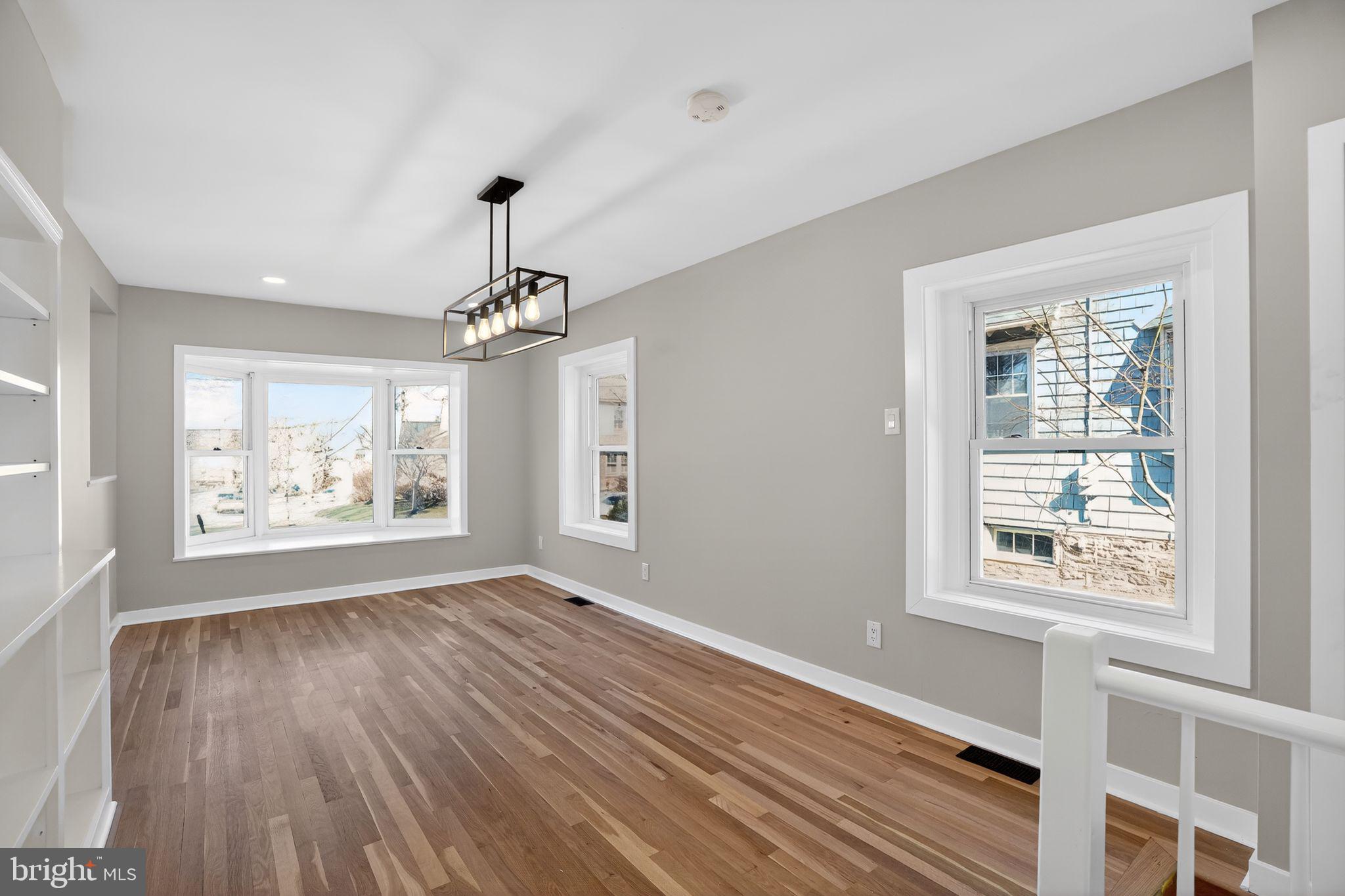 99 Rorer Street Glenside, PA 19038 - Photo 19 of 36 a view of an empty room with wooden floor and a window