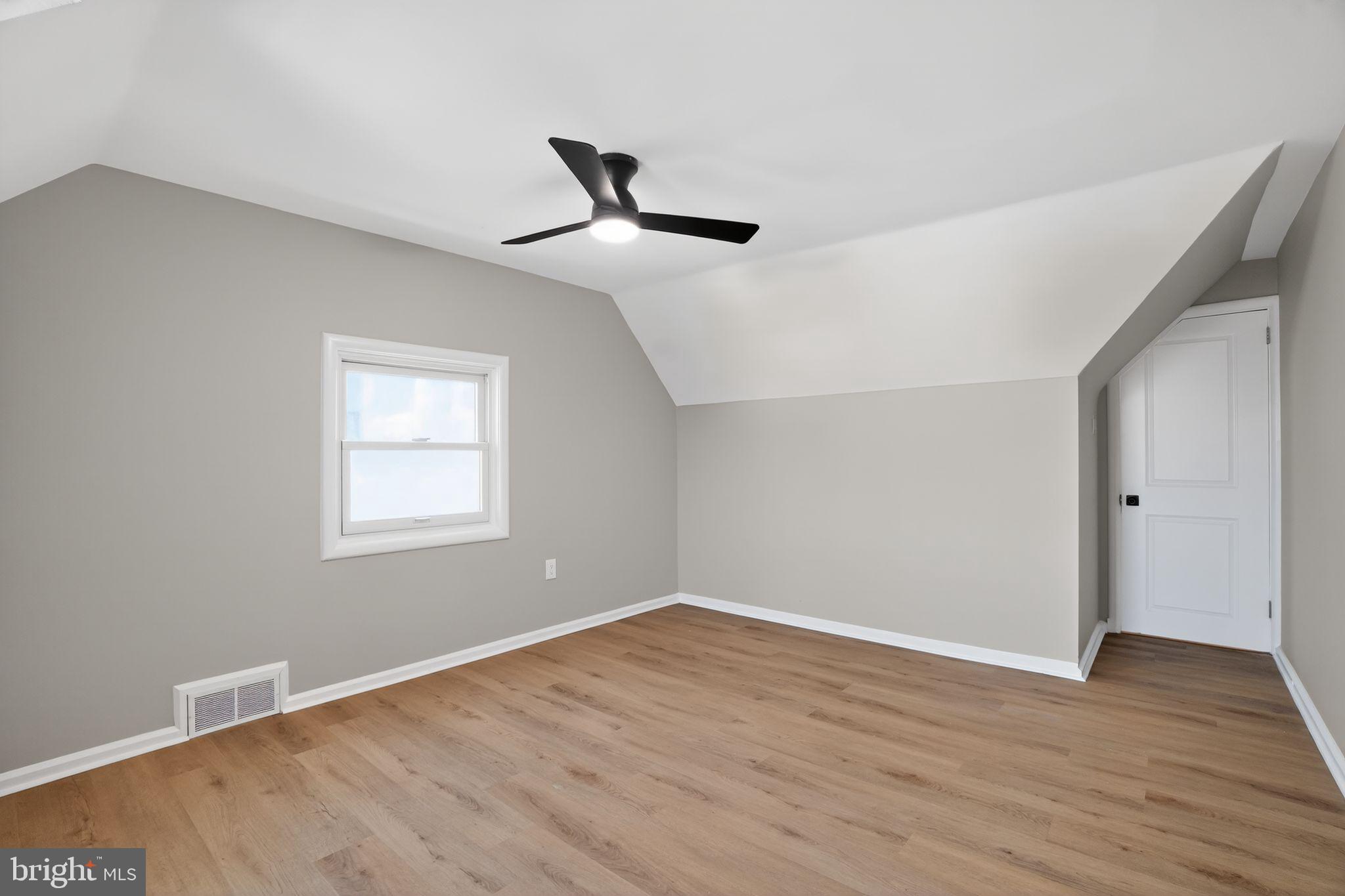 99 Rorer Street Glenside, PA 19038 - Photo 22 of 36 a view of empty room with wooden floor and fan