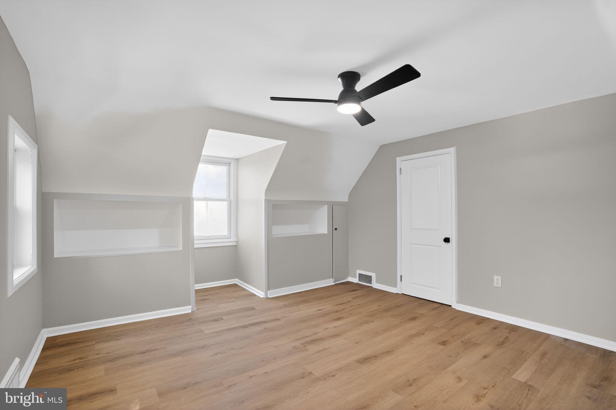 99 Rorer Street Glenside, PA 19038 - Photo 23 of 36 a view of empty room with wooden floor and fan