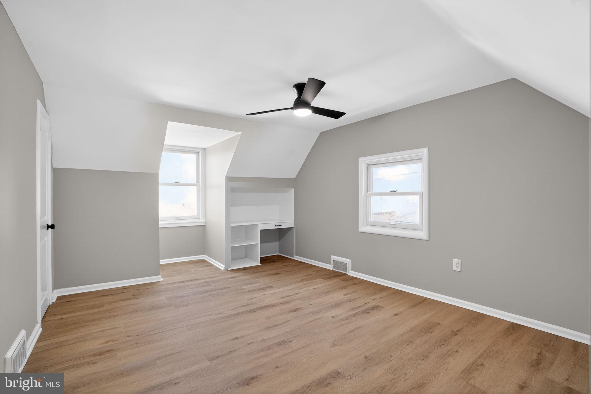 99 Rorer Street Glenside, PA 19038 - Photo 25 of 36 a view of empty room with wooden floor and fan