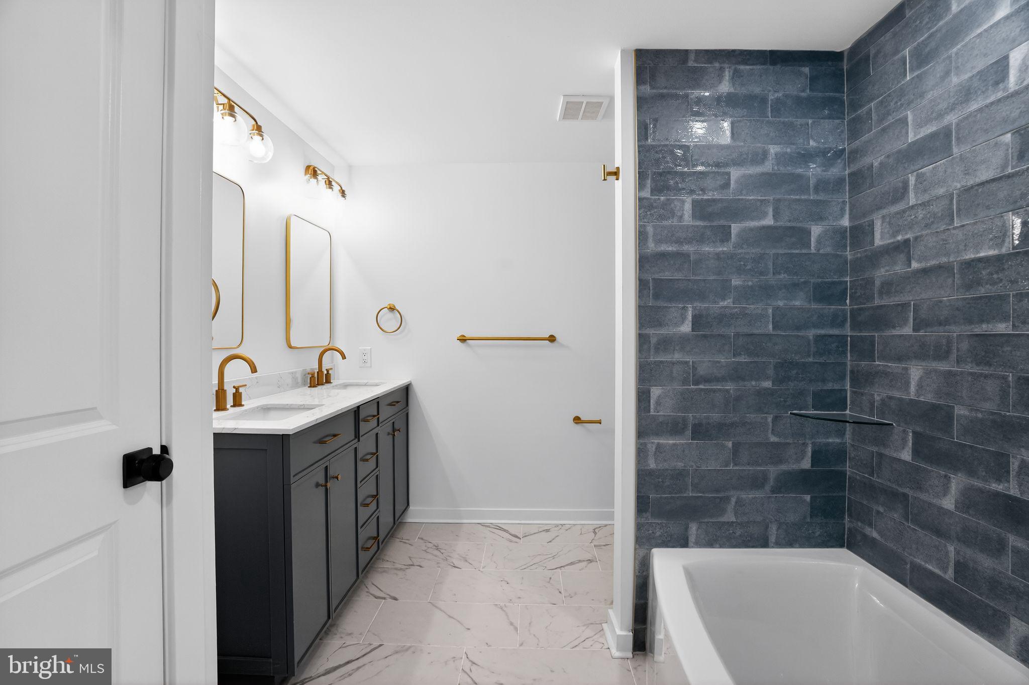 99 Rorer Street Glenside, PA 19038 - Photo 28 of 36 a bathroom with a bathtub sink and mirror