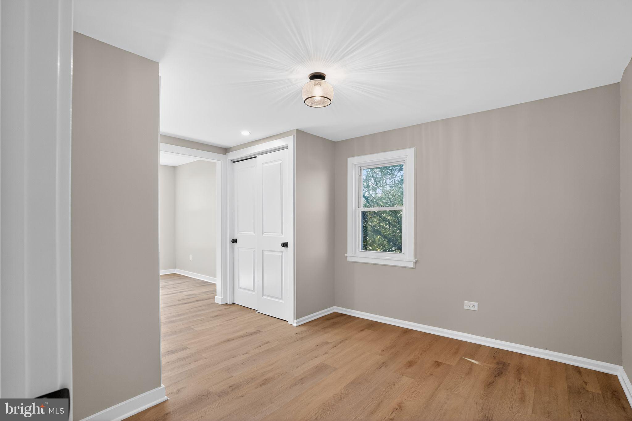 99 Rorer Street Glenside, PA 19038 - Photo 30 of 36 a view of an empty room with wooden floor and a window