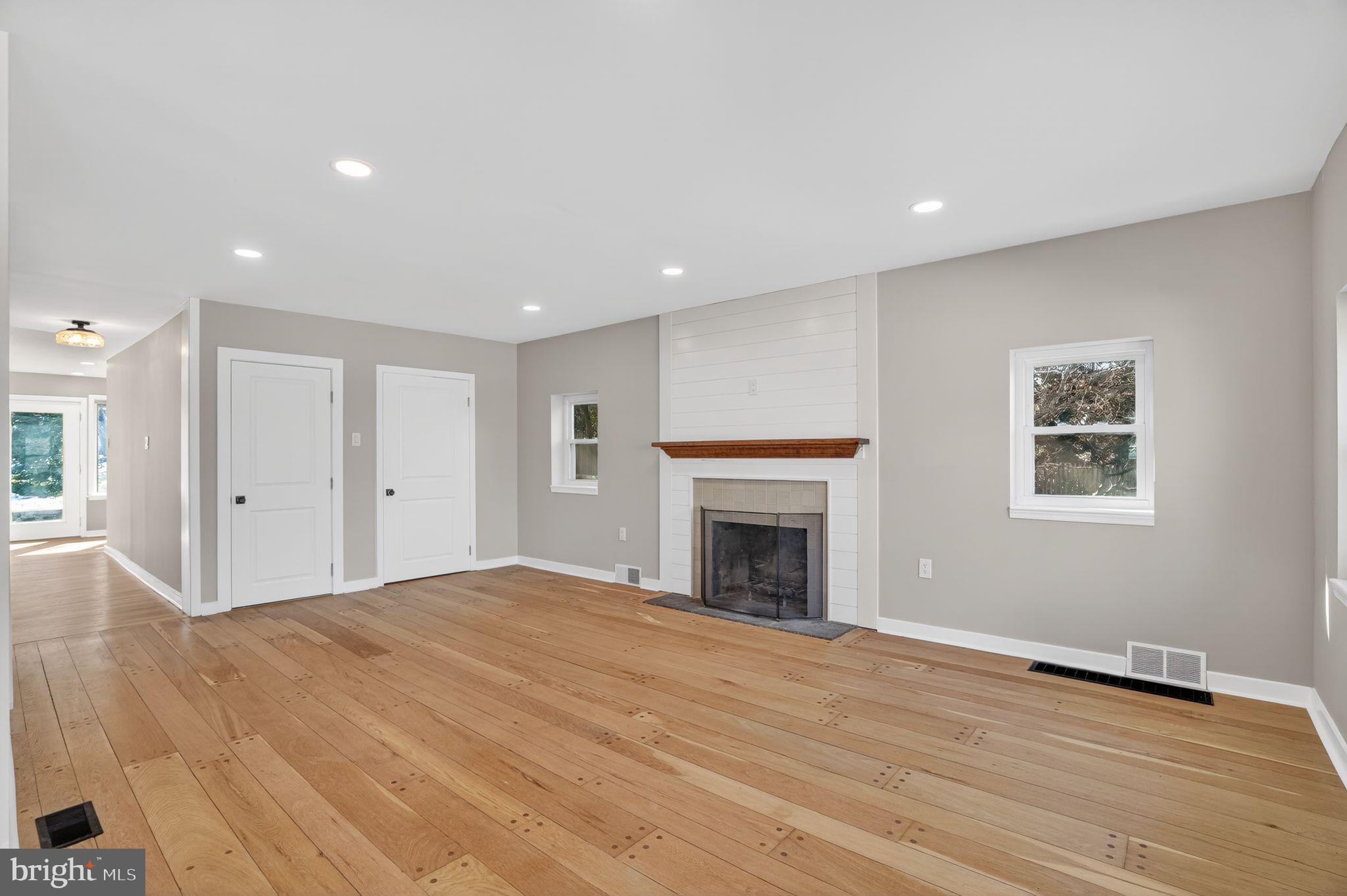 99 Rorer Street Glenside, PA 19038 - Photo 3 of 36 a view of empty room with wooden floor and fireplace