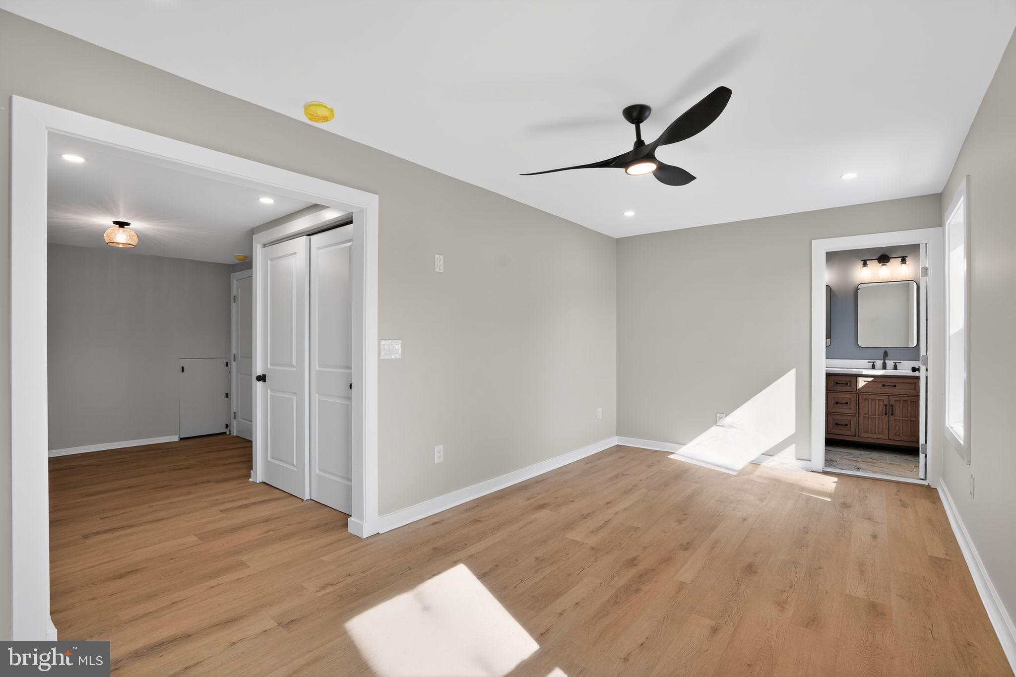 99 Rorer Street Glenside, PA 19038 - Photo 31 of 36 a view of a hallway with wooden floor and a ceiling fan