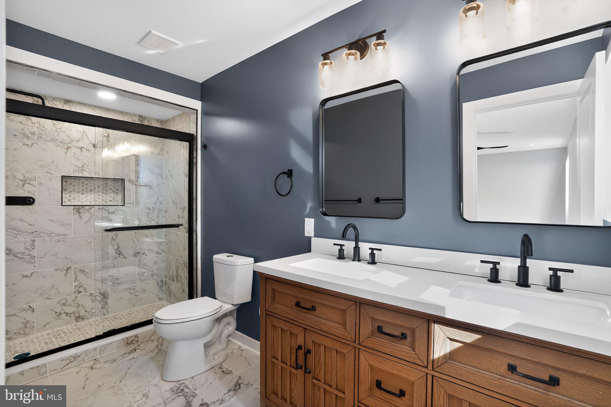 99 Rorer Street Glenside, PA 19038 - Photo 33 of 36 a bathroom with a double vanity sink mirror and toilet