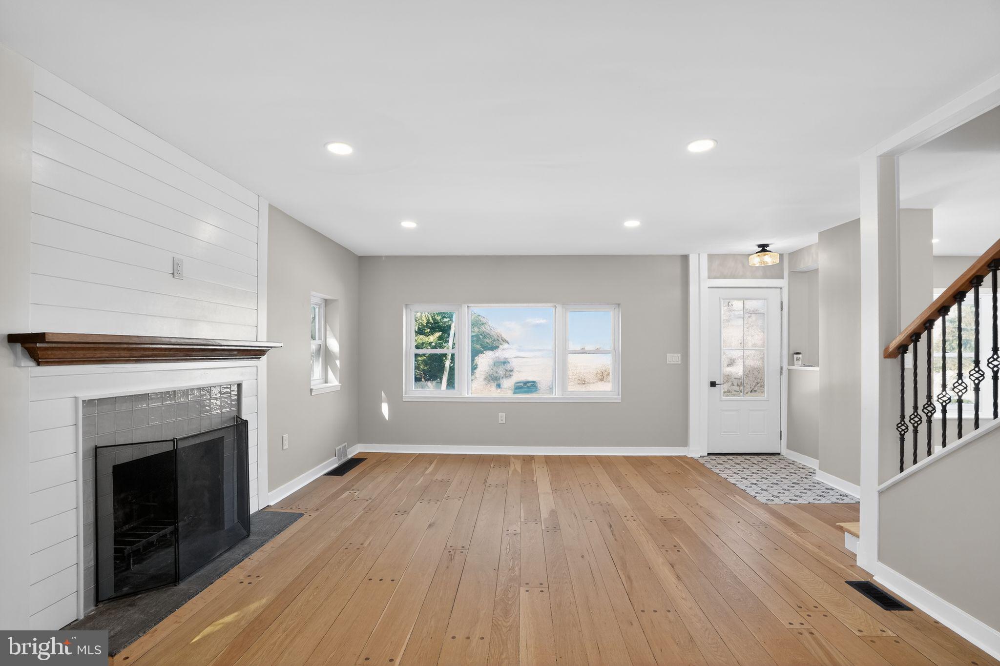 99 Rorer Street Glenside, PA 19038 - Photo 4 of 36 an empty room with windows and fireplace