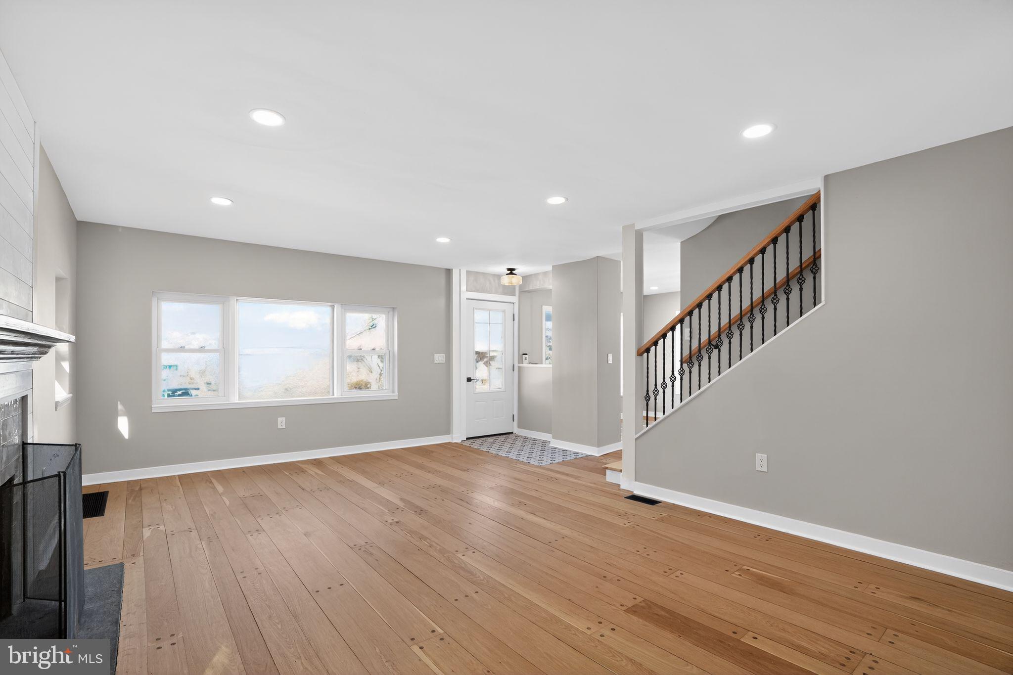 99 Rorer Street Glenside, PA 19038 - Photo 6 of 36 a view of an empty room with wooden floor and staircase