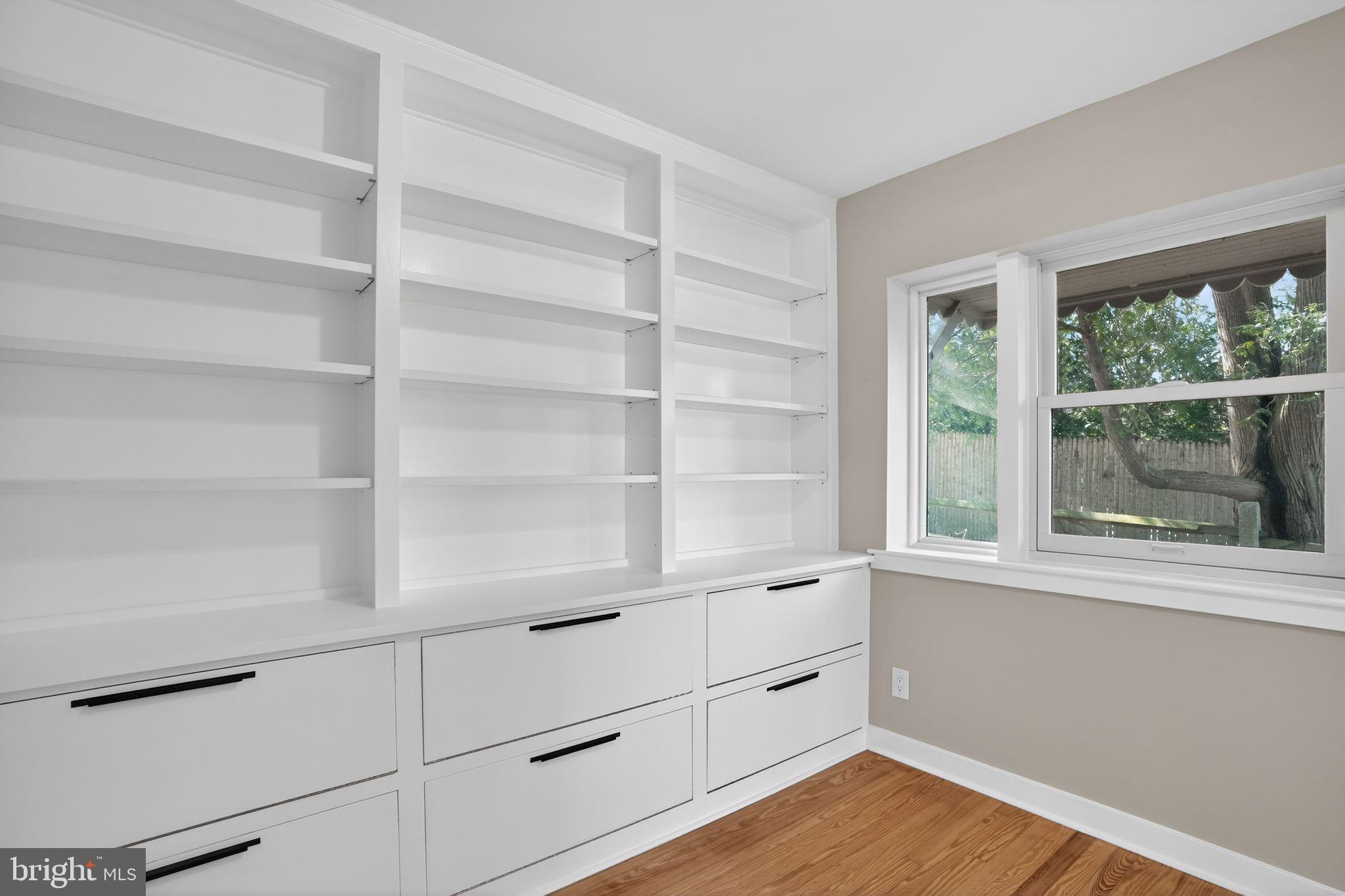 99 Rorer Street Glenside, PA 19038 - Photo 9 of 36 a room with a desk and wooden floor
