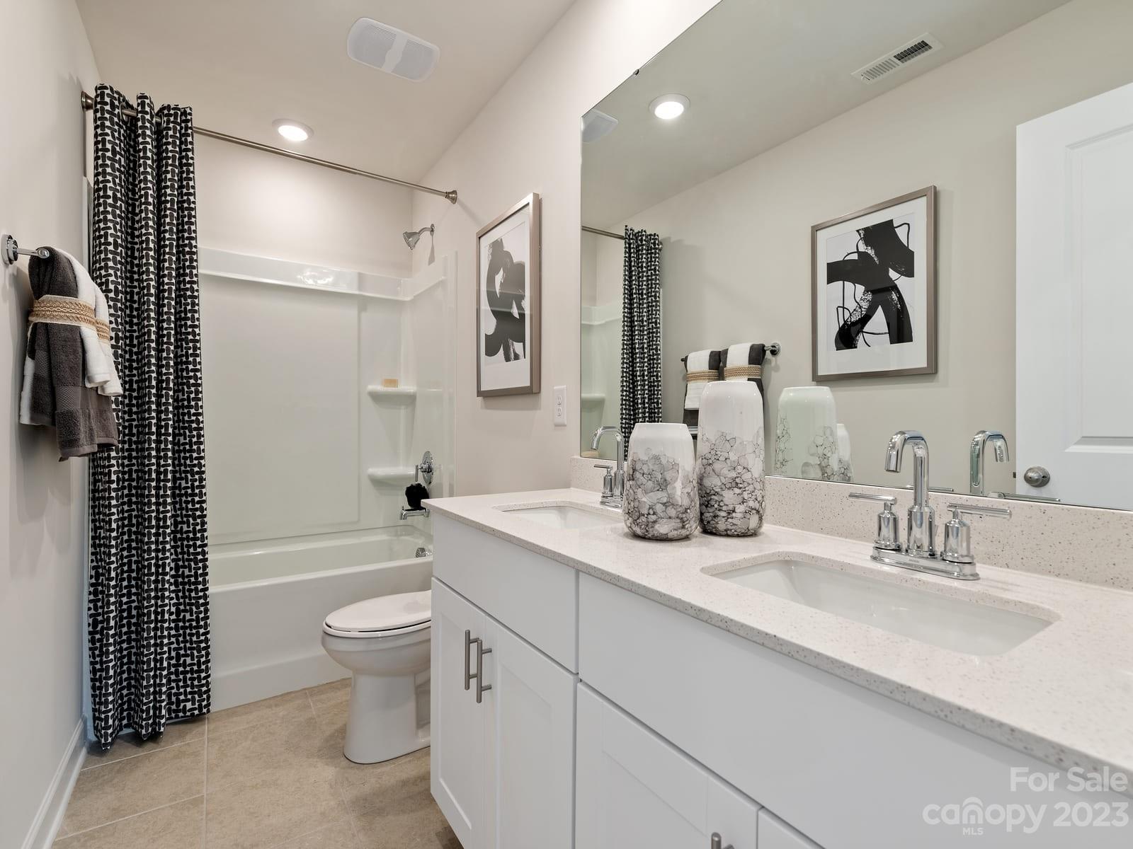 209 Canoga Avenue York, SC 29745 - Photo 11 of 18 a bathroom with a double vanity sink toilet and shower