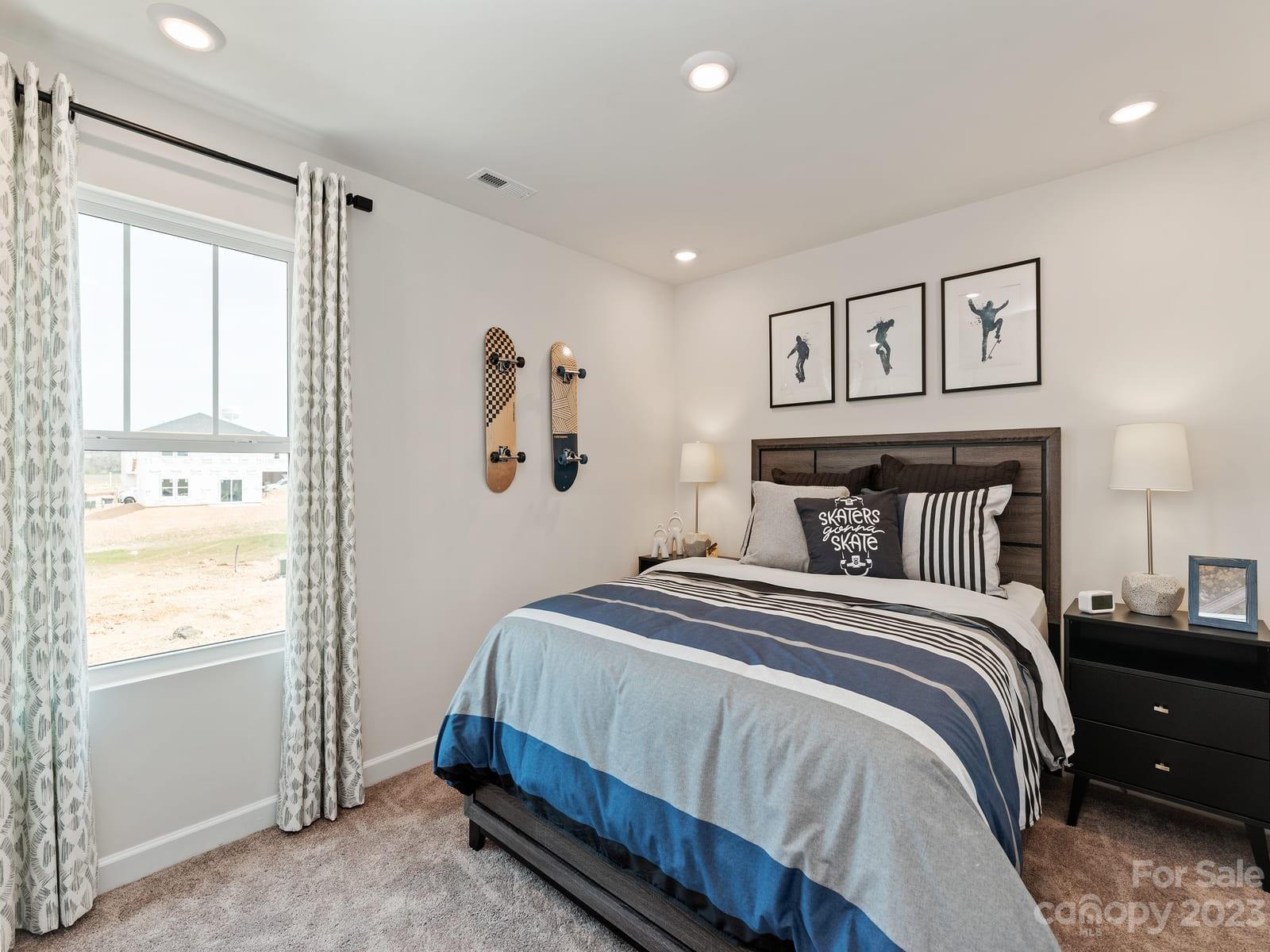 209 Canoga Avenue York, SC 29745 - Photo 13 of 18 a bedroom with a bed and a window
