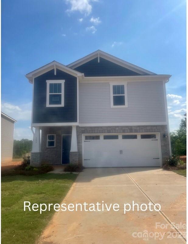 209 Canoga Avenue York, SC 29745 - Photo 18 of 18 a front view of a house with a garden