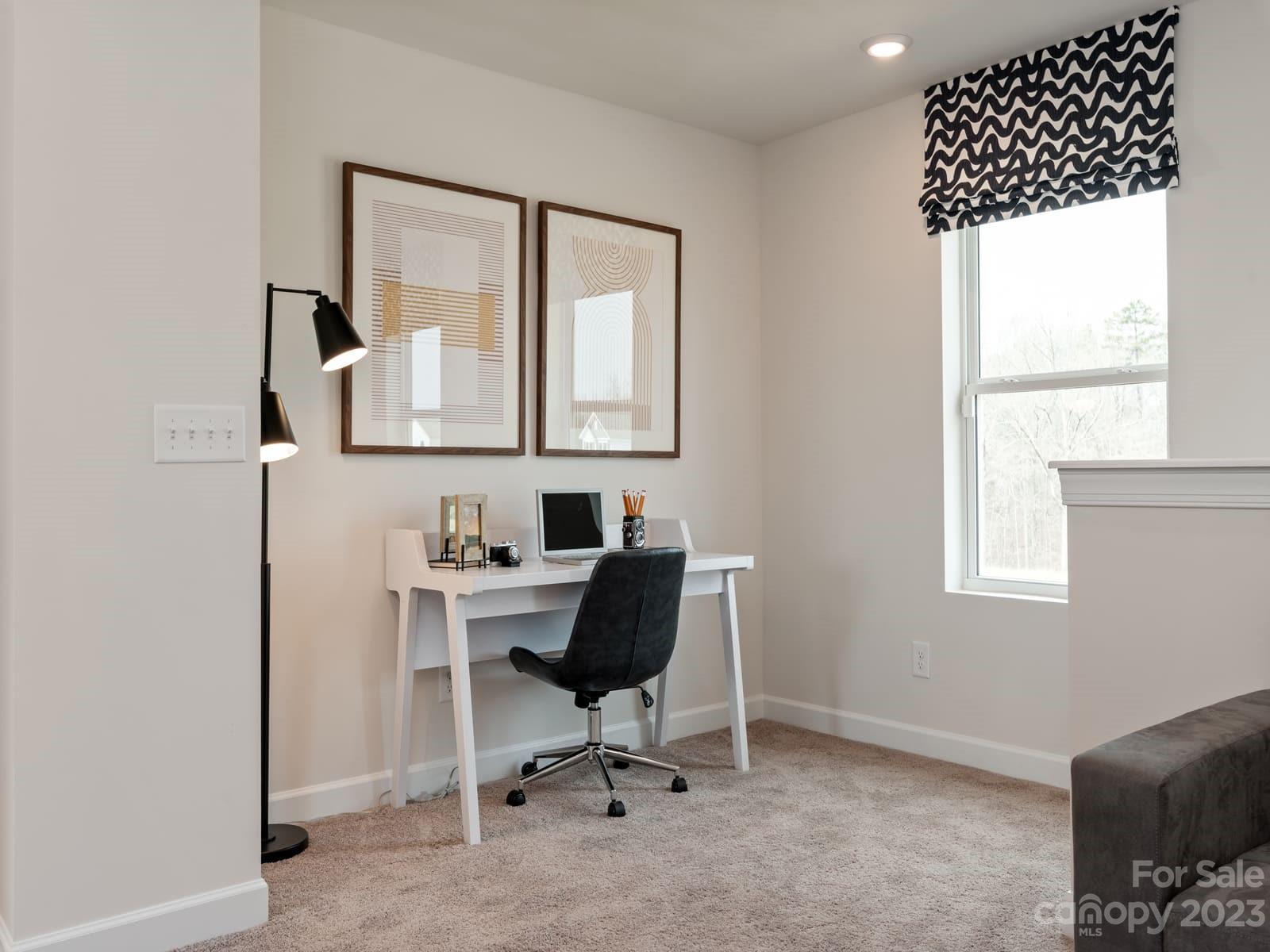 209 Canoga Avenue York, SC 29745 - Photo 8 of 18 a view of workspace with wooden floor windows