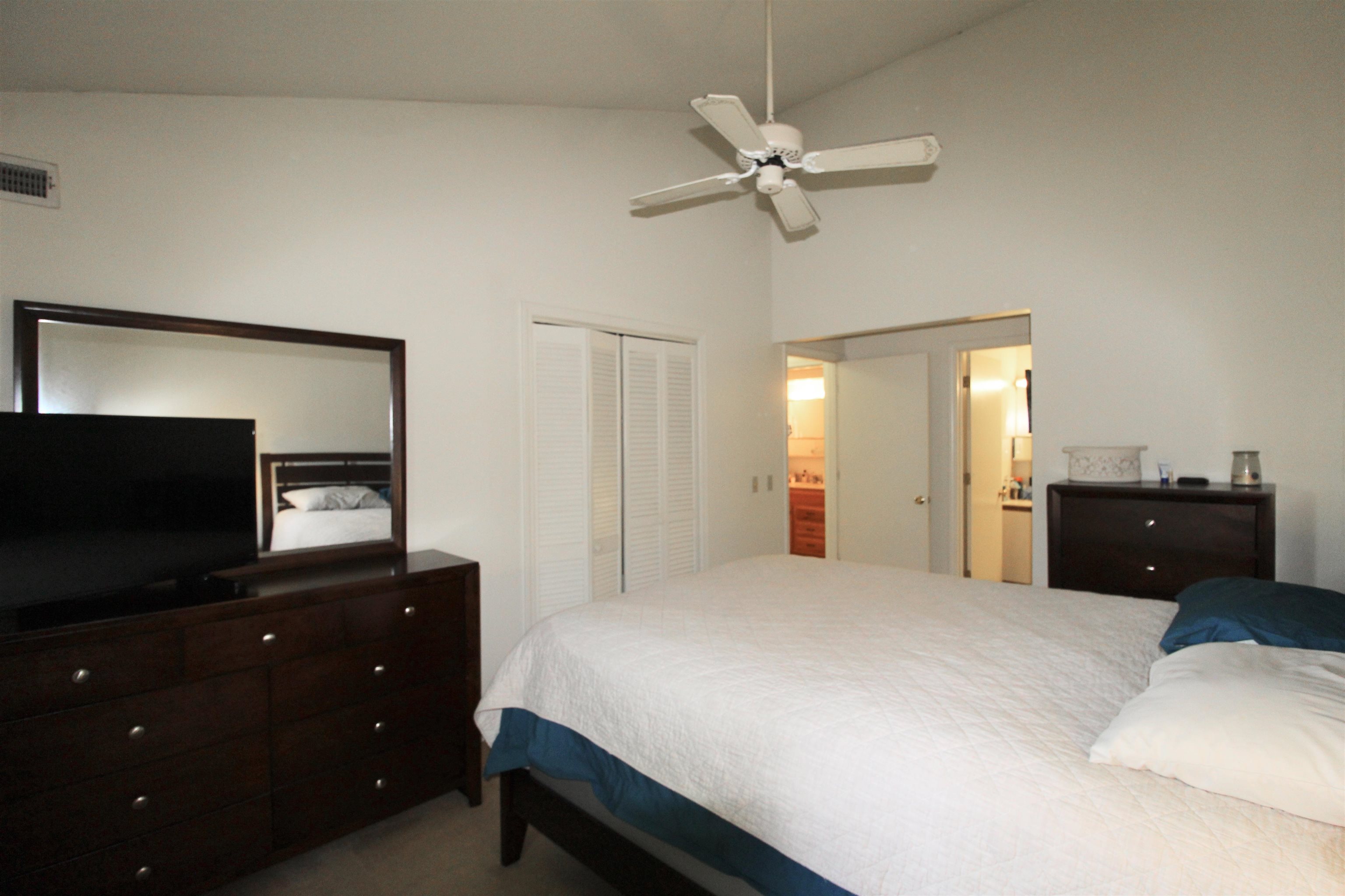 1116 Blue Ridge Drive, Unit 10 Harrisonburg, VA 22802 - Photo 11 of 20 a bedroom with a bed and a flat tv screen on dresser