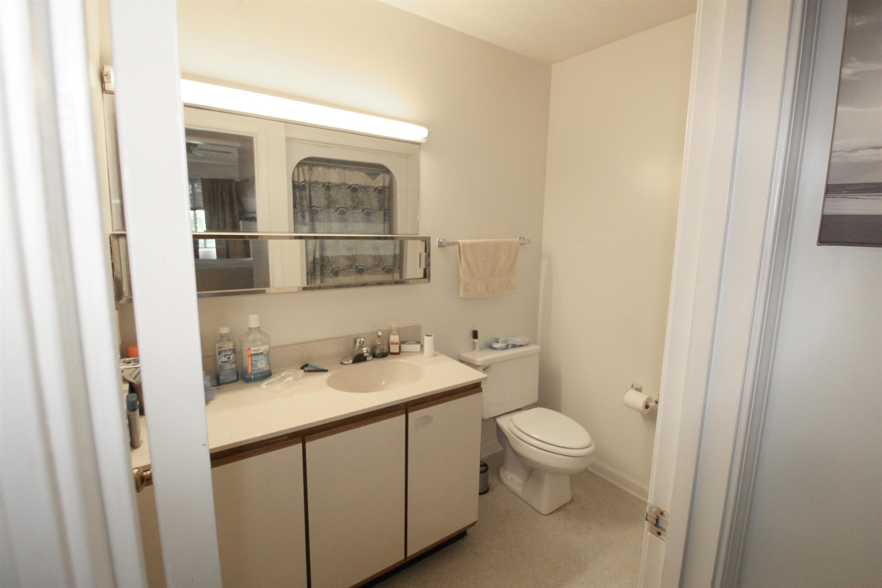 1116 Blue Ridge Drive, Unit 10 Harrisonburg, VA 22802 - Photo 17 of 20 a bathroom with a sink a toilet and shower