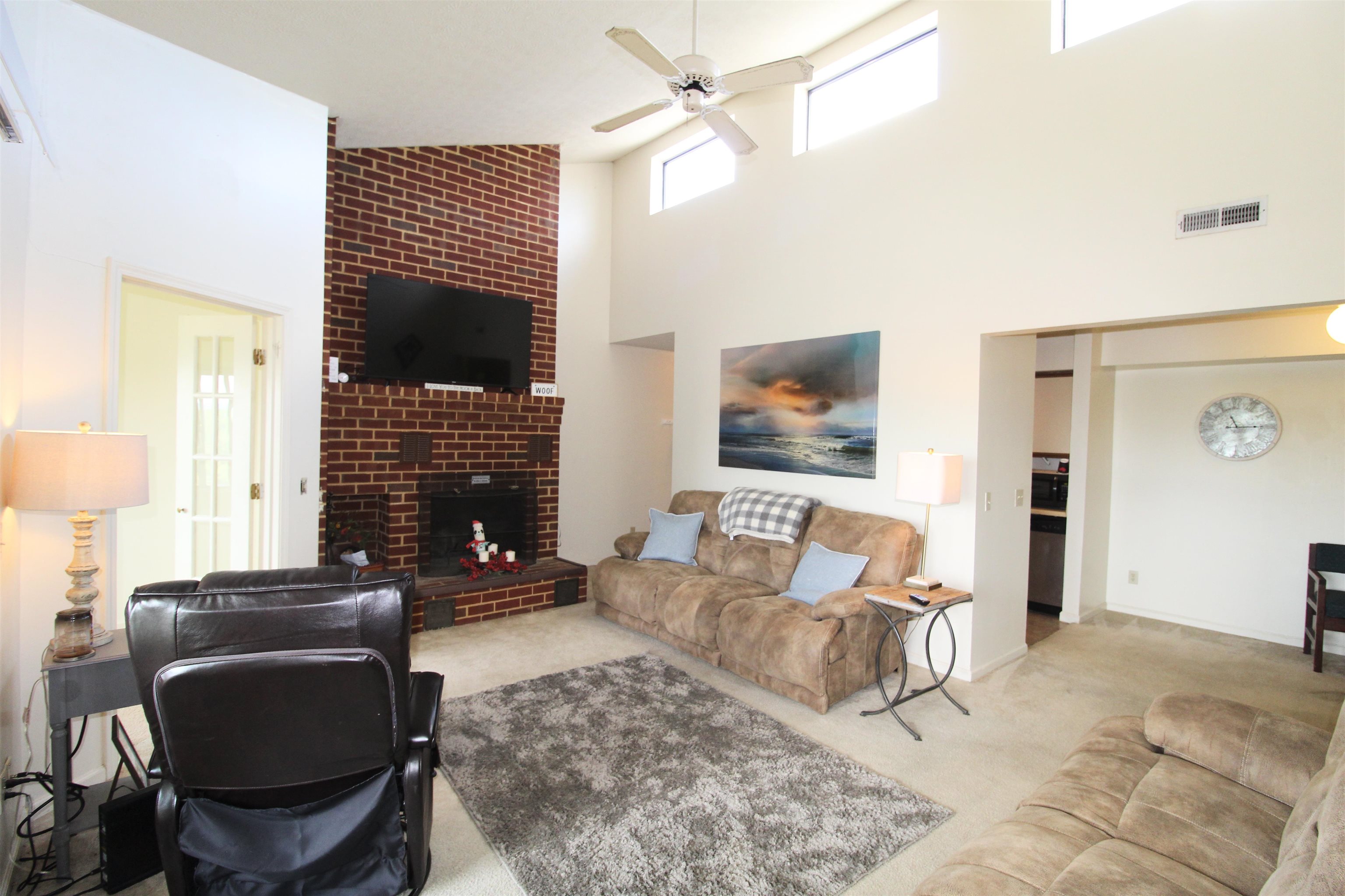1116 Blue Ridge Drive, Unit 10 Harrisonburg, VA 22802 - Photo 3 of 20 a living room with furniture a flat screen tv and a fireplace