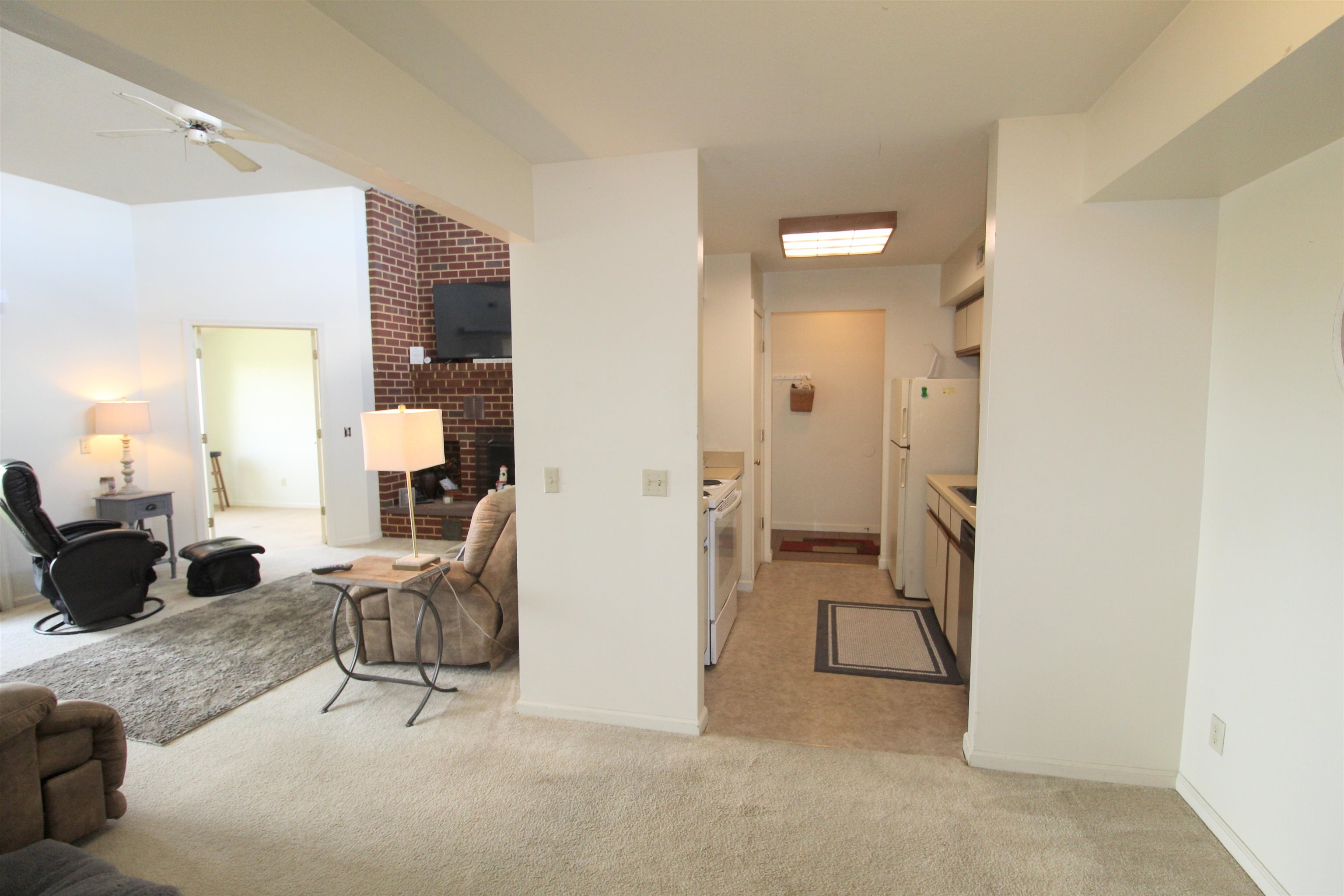 1116 Blue Ridge Drive, Unit 10 Harrisonburg, VA 22802 - Photo 6 of 20 a living room with furniture and a chandelier
