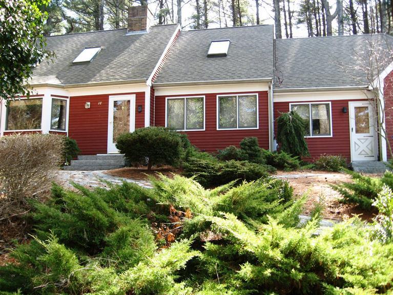 18 Valley Bars Road Pocasset, MA 02559 - Photo 2 of 5 a view of a brick house with a yard and plants