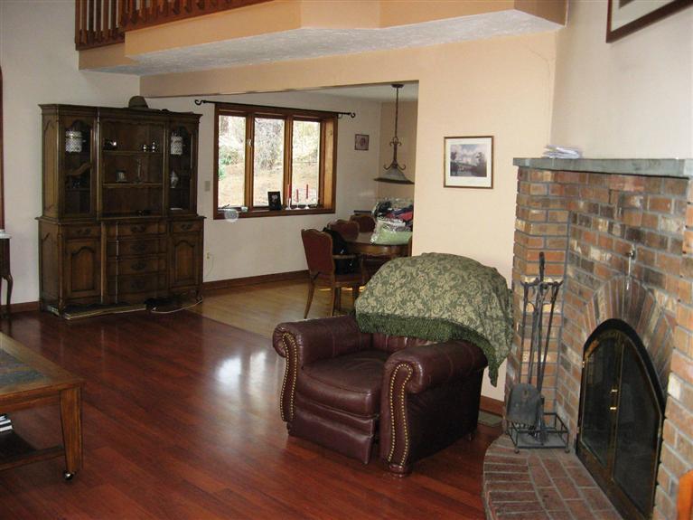 18 Valley Bars Road Pocasset, MA 02559 - Photo 3 of 5 a living room with furniture and a fireplace