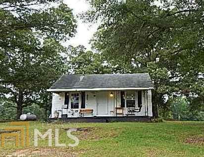 747 Priddy Road LaGrange, GA 30241 - Photo 1 of 1 a front view of a house with a garden and swimming pool