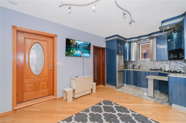a spacious bathroom with a sink a mirror and a shower