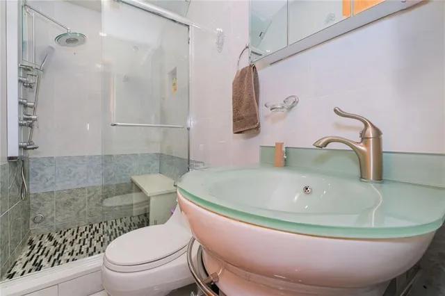 a bathroom with a sink and toilet