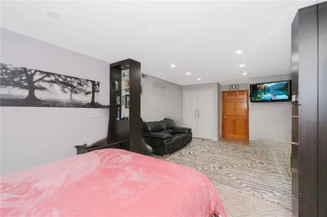 a bedroom with a bed and a view of bathroom