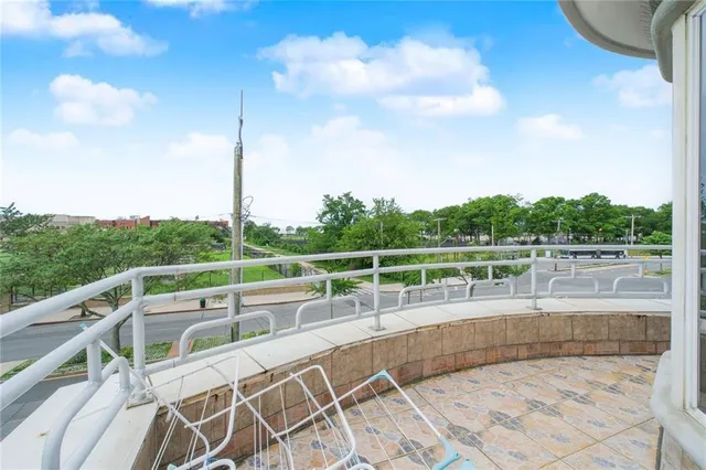 a view of a roof deck with couches and sky view