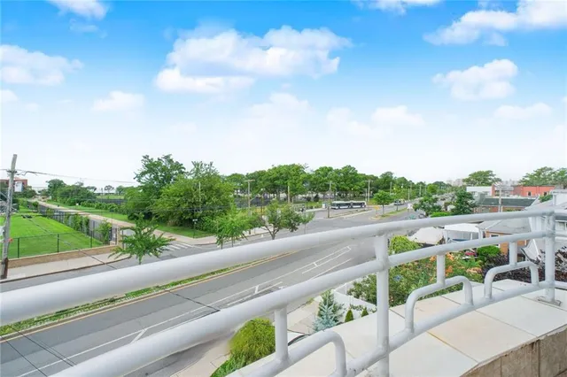 a view of a road with a big yard