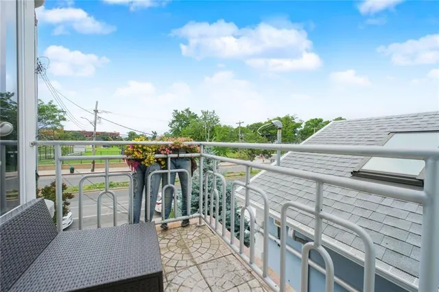 a view of a balcony with mountain view and wooden floor