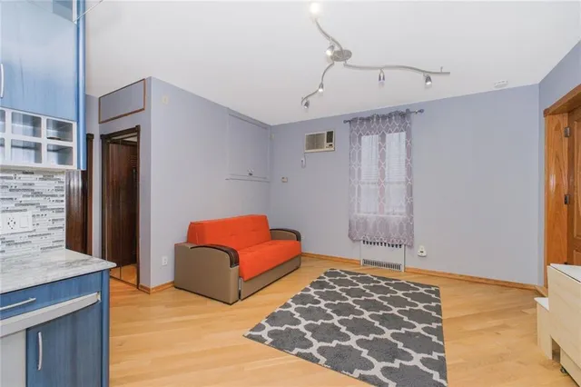 a bedroom with furniture and a rug