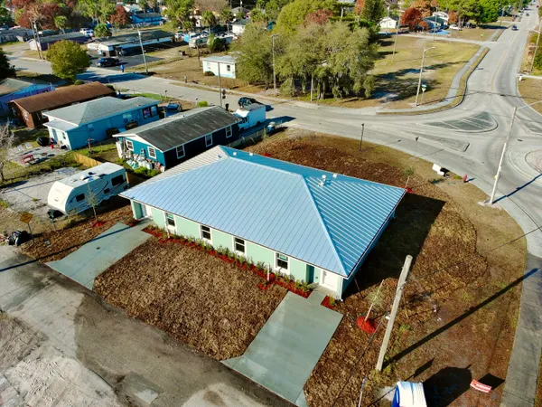 an aerial view of a houses with an outdoor space