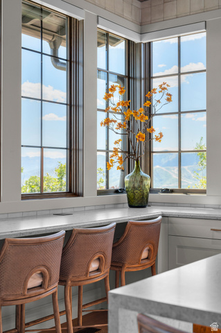 2192 East Outlaw Road Kamas, UT 84036 - Photo 59 of 80 Corner window seating with a light-toned countertop, subway tile backsplash, and built-in power outlets