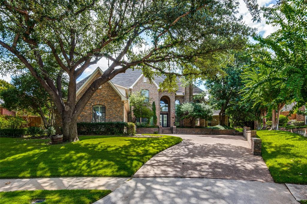 1700 MacGregor Drive Plano, TX 75093 - Photo 1 of 1 a front view of a house with a yard