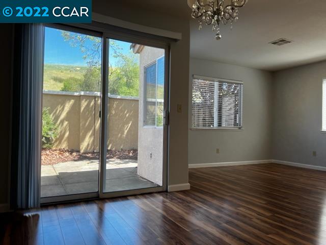 1136 Vista Pointe Circle San Ramon, CA 94583 - Photo 11 of 26 a view of an empty room with wooden floor and a window