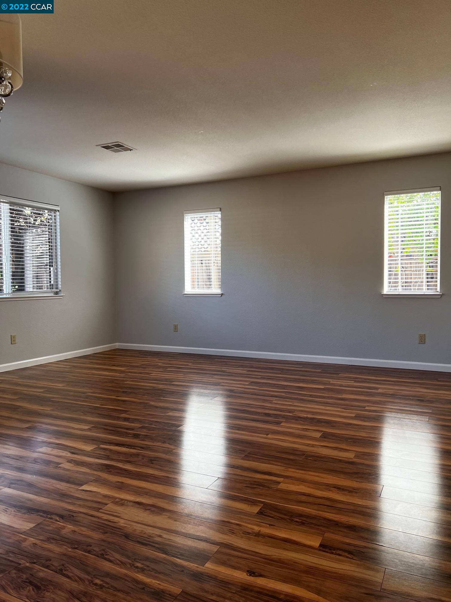 1136 Vista Pointe Circle San Ramon, CA 94583 - Photo 12 of 26 an empty room with wooden floor and windows