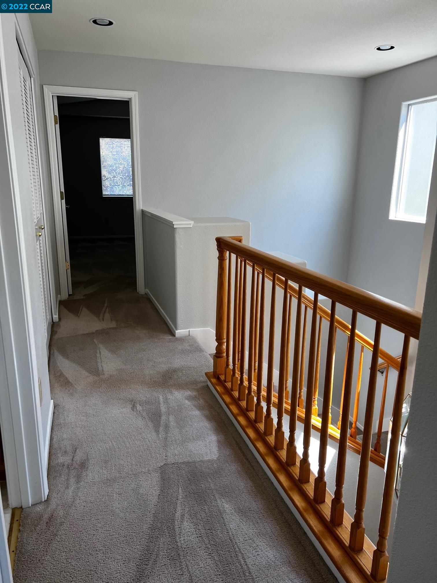 1136 Vista Pointe Circle San Ramon, CA 94583 - Photo 18 of 26 a view of a hallway with wooden floor and stairs