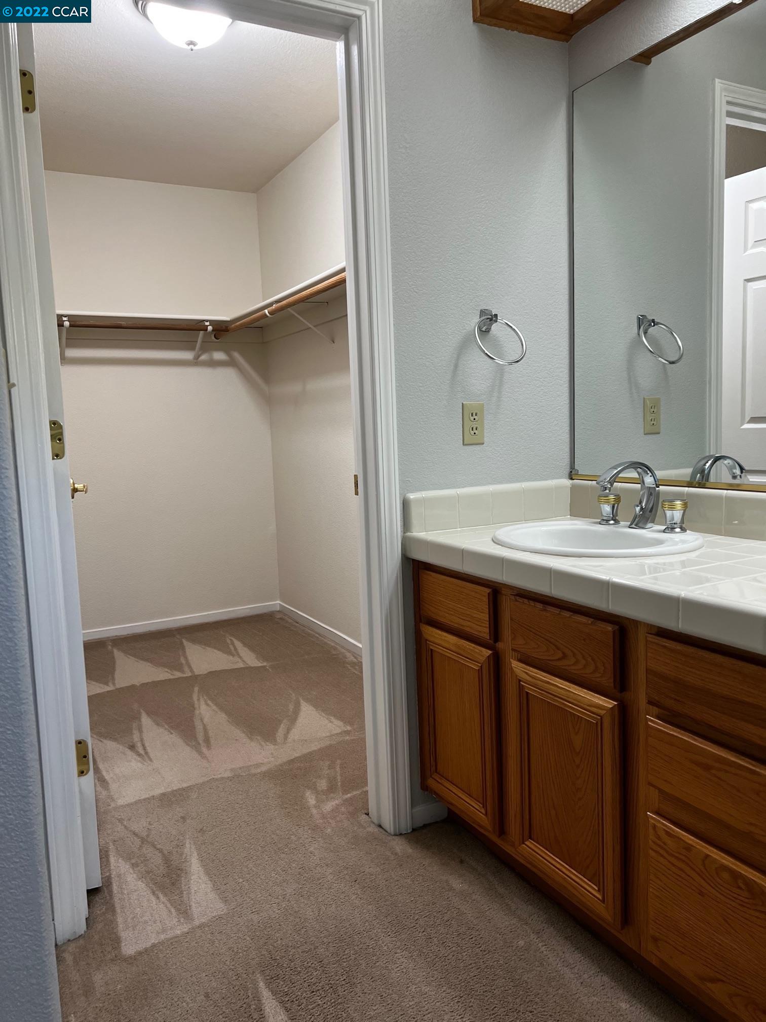 1136 Vista Pointe Circle San Ramon, CA 94583 - Photo 21 of 26 a bathroom with a sink and a mirror