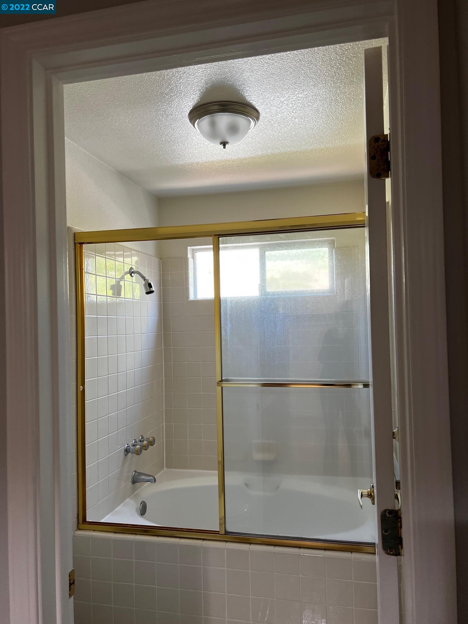 1136 Vista Pointe Circle San Ramon, CA 94583 - Photo 24 of 26 a bathroom with a glass shower door