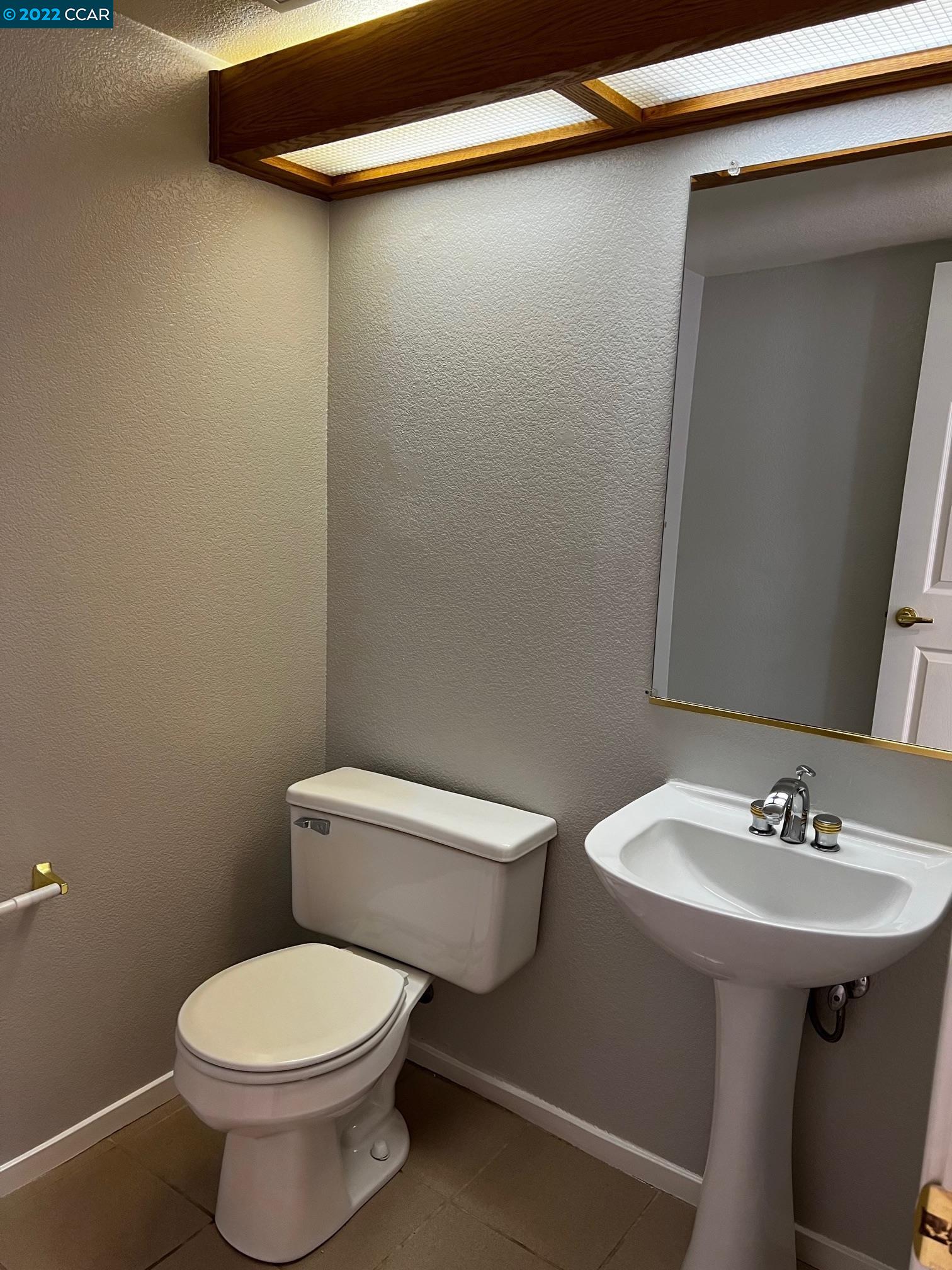 1136 Vista Pointe Circle San Ramon, CA 94583 - Photo 8 of 26 a white toilet sitting next to a bathroom sink