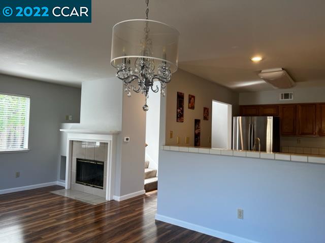 1136 Vista Pointe Circle San Ramon, CA 94583 - Photo 10 of 26 a view of a livingroom with a fireplace wooden floor and a chandelier