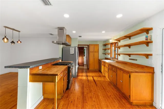 a very nice looking room with wooden floor