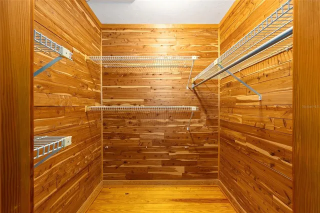 a view of a wooden deck with a yard