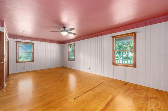 a view of a house with yard and sitting area