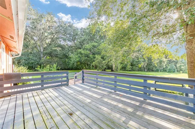 a view of a garden with a building in the background