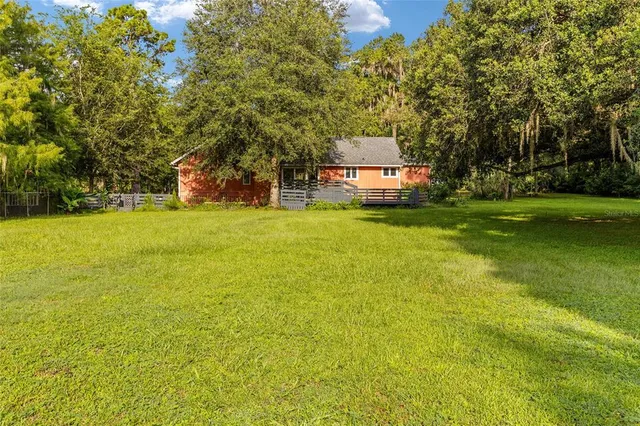 a aerial view of a house with a yard