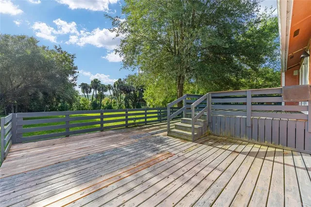 a view of a house with yard and sitting area